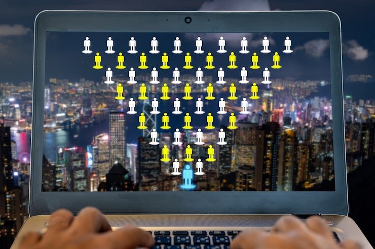 Laptop displaying network of people icons